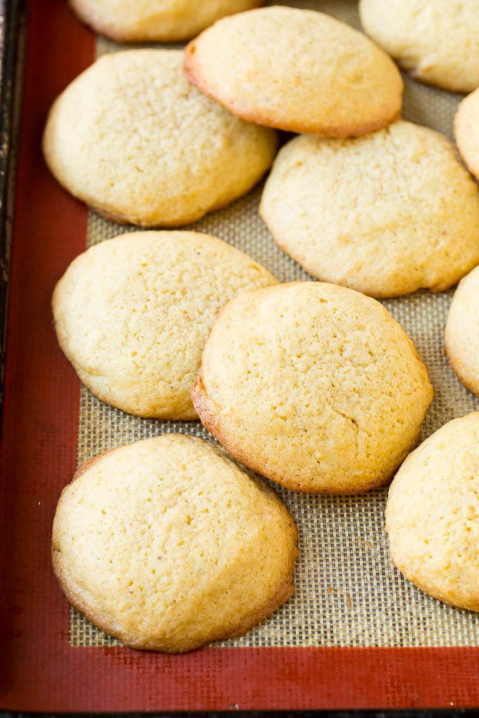 Eggnog Cookies Recipe | Holiday Cookies | Christmas Cookies #cookies #eggnog #baking #christmas #sprinkles #dessert #ezlod Baked eggnog cookies on a sheet pan.