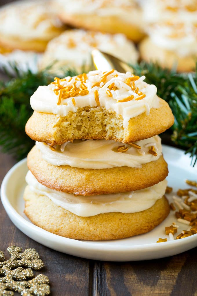 Eggnog Cookies Recipe | Holiday Cookies | Christmas Cookies #cookies #eggnog #baking #christmas #sprinkles #dessert #ezlod A stack of eggnog cookies with a bite taken out of one.