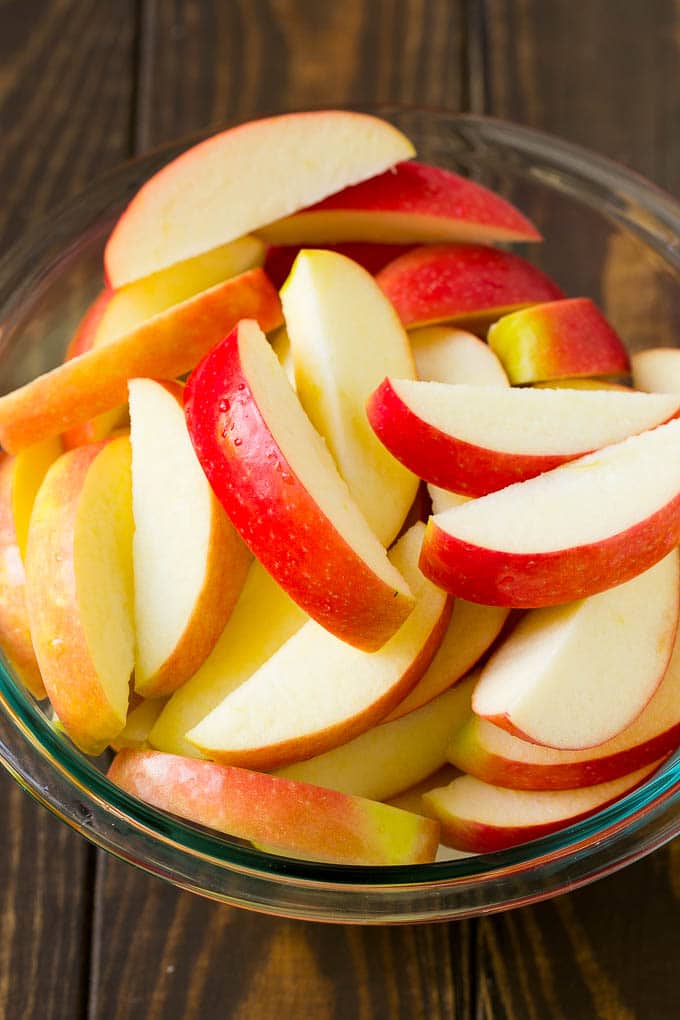 Fried Apples Recipe | Sauteed Apples | Cinnamon Sugar Apples #apples #cinnamon #sugar #sidedish #dessert #ezlod #fall Sliced apples in a mixing bowl.