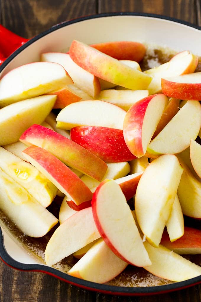 Fried Apples Recipe | Sauteed Apples | Cinnamon Sugar Apples #apples #cinnamon #sugar #sidedish #dessert #ezlod #fall Sliced apples in a pan with butter, sugar and cinnamon.