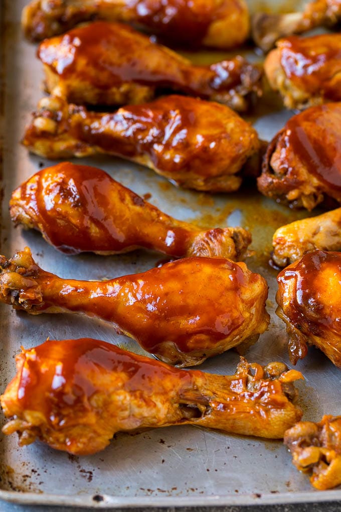 Slow Cooker Chicken Drumsticks Recipe | Crock Pot Chicken Drumsticks | BBQ Chicken Drumsticks #chicken #drumsticks #slowcooker #crockpot #bbq #dinner #ezlod Slow cooker chicken drumsticks on a sheet pan, ready for the broiler.