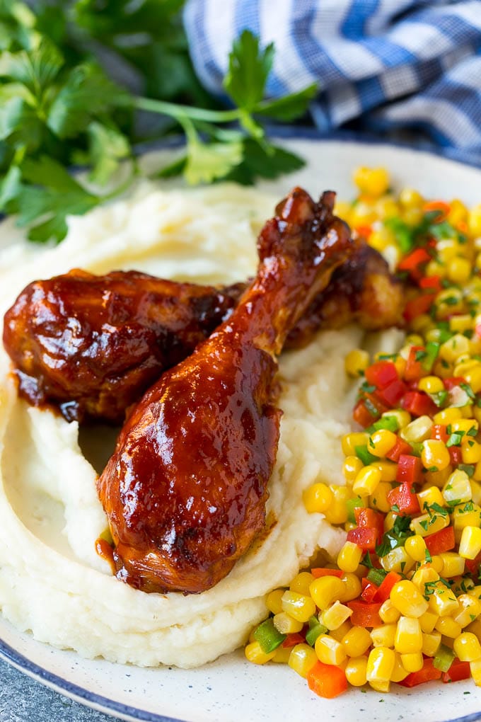 Slow Cooker Chicken Drumsticks Recipe | Crock Pot Chicken Drumsticks | BBQ Chicken Drumsticks #chicken #drumsticks #slowcooker #crockpot #bbq #dinner #ezlod Slow cooker chicken drumsticks served with mashed potatoes and corn.