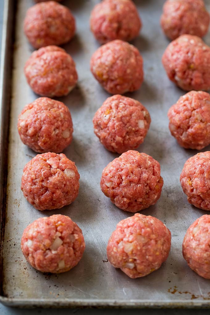 Sweet and Sour Meatballs Recipe | Slow Cooker Meatballs | Crockpot Meatballs | Cocktail Meatballs #meatballs #beef #slowcooker #crockpot #dinner #appetizer #ezlod Homemade meatballs on a sheet pan.