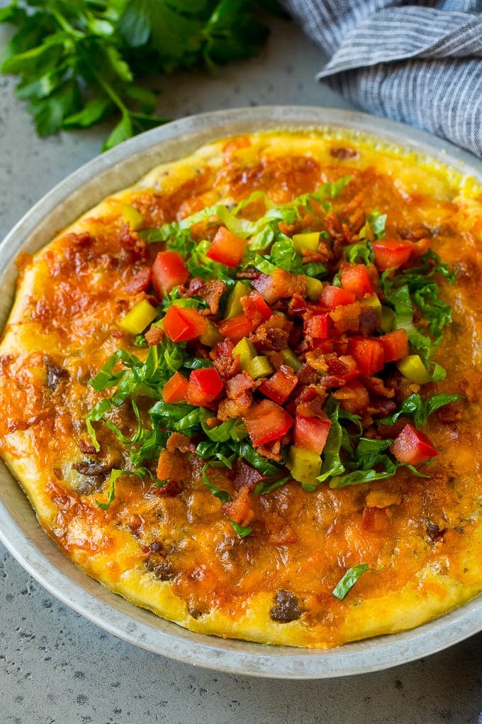 Cheeseburger Pie Recipe | Cheeseburger Casserole | Ground Beef Recipe #cheeseburger #beef #bacon #cheese #casserole #dinner #ezlod Cheeseburger pie topped with bacon, lettuce, pickles and tomatoes.