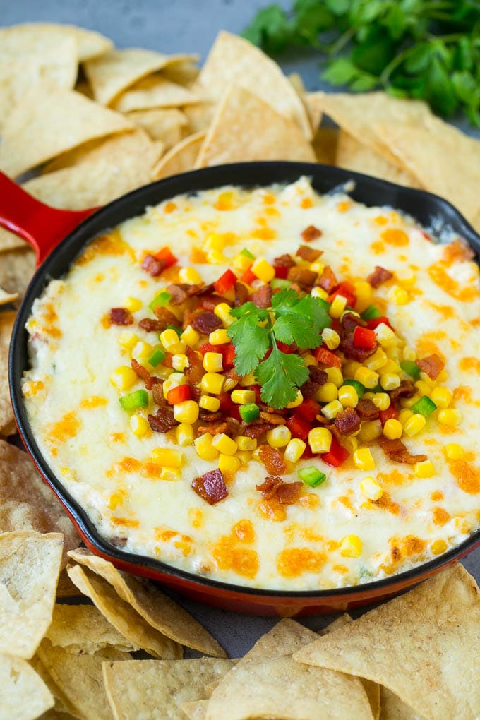 Corn Dip Recipe | Hot Cheese Dip | Bacon Dip #corn #dip #bacon #cheese #appetizer #snack #ezlod Hot corn dip made with two types of cheese, corn, peppers and bacon, served with tortilla chips.