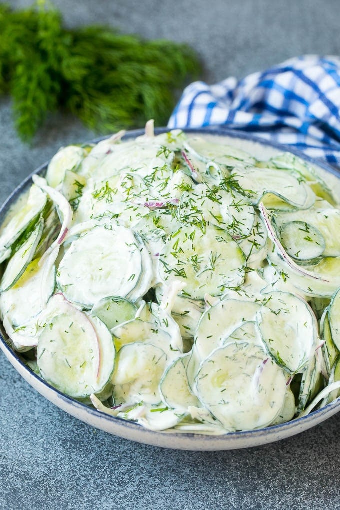 Creamy Cucumber Salad Recipe | German Cucumber Salad | Cucumber Salad #cucumber #salad #dinner #lunch #ezlod #cucumbersalad A serving bowl of creamy cucumber salad topped with fresh dill.