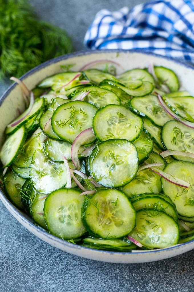 Cucumber Salad Recipe | Cucumber Dill Salad | Cucumber Recipe #cucumbers #salad #glutenfree #sidedish #ezlod A bowl of cucumber salad with red onion, thinly sliced cucumbers and chopped dill.