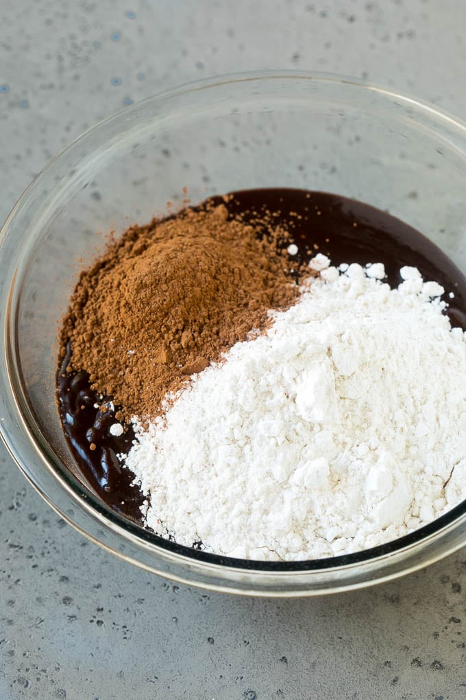Oreo Brownies Recipe | Homemade Brownies | Chocolate Chip Brownies #brownies #oreos #chocolate #dessert #sweets #ezlod Melted chocolate, sugar, cocoa powder and flour in a mixing bowl.