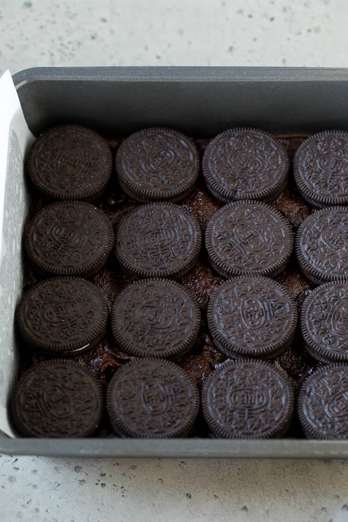 Oreo Brownies Recipe | Homemade Brownies | Chocolate Chip Brownies #brownies #oreos #chocolate #dessert #sweets #ezlod A layer of brownie batter with a layer of Oreo cookies on top.
