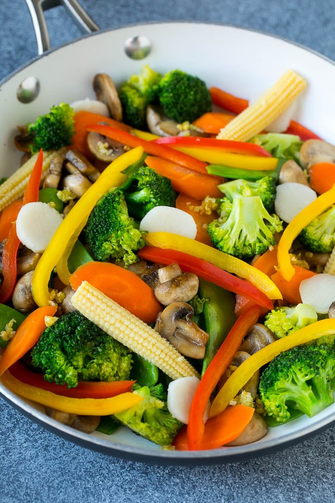 Vegetable Stir Fry Recipe | Veggie Stir Fry | Broccoli Stir Fry #vegetarian #vegetables #broccoli #dinner #ezlod A pan of sauteed baby corn, water chestnuts, peppers, broccoli and mushrooms.