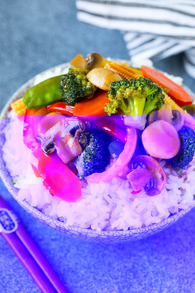 Vegetable Stir Fry Recipe | Veggie Stir Fry | Broccoli Stir Fry #vegetarian #vegetables #broccoli #dinner #ezlod Vegetable stir fry served over rice in a bowl.