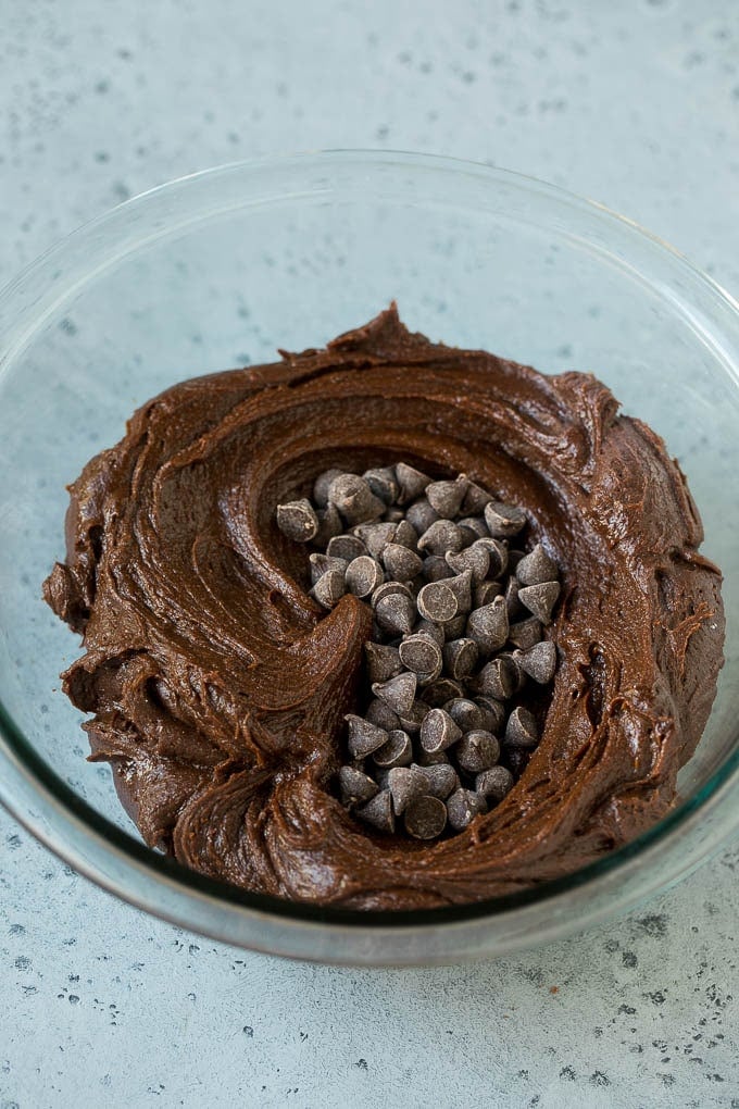 Cheesecake Brownies Recipe | Cream Cheese Brownies | Homemade Brownies #brownies #cheesecake #chocolate #dessert #ezlod Brownie batter and chocolate chips in a mixing bowl.