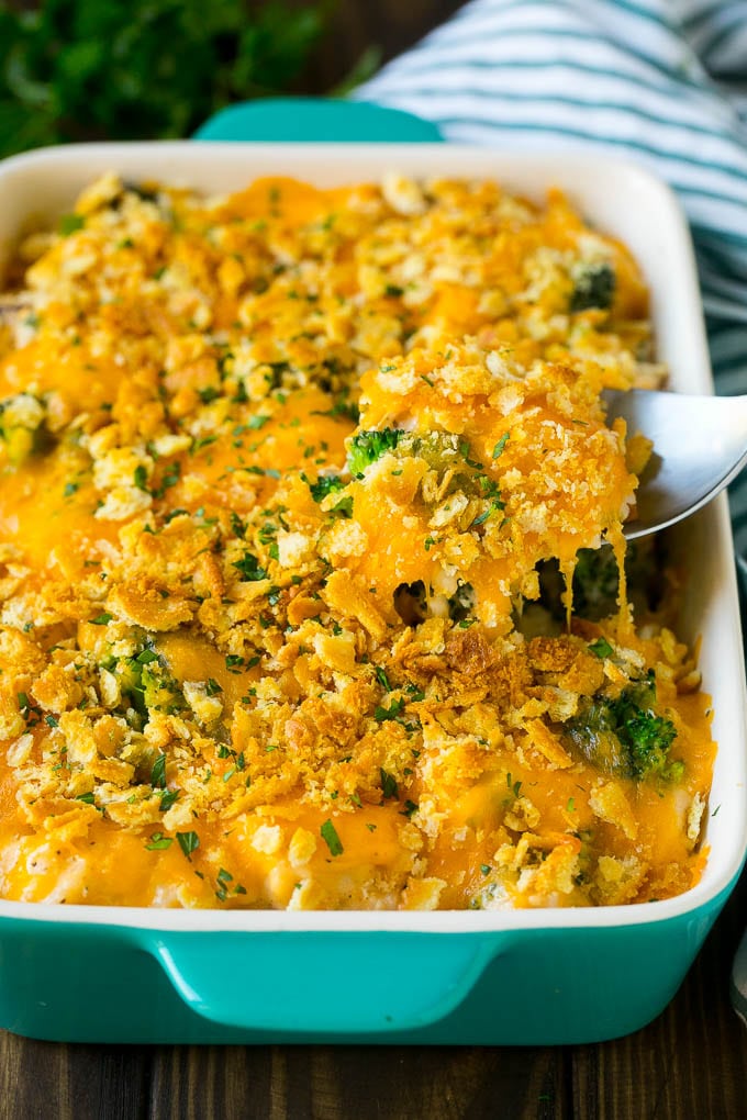 Chicken Casserole Recipe | Chicken and Rice Casserole | Chicken and Broccoli Casserole #casserole #chicken #rice #broccoli #cheese #dinner #ezlod A spoon serving up a portion of chicken casserole made with rice and broccoli.