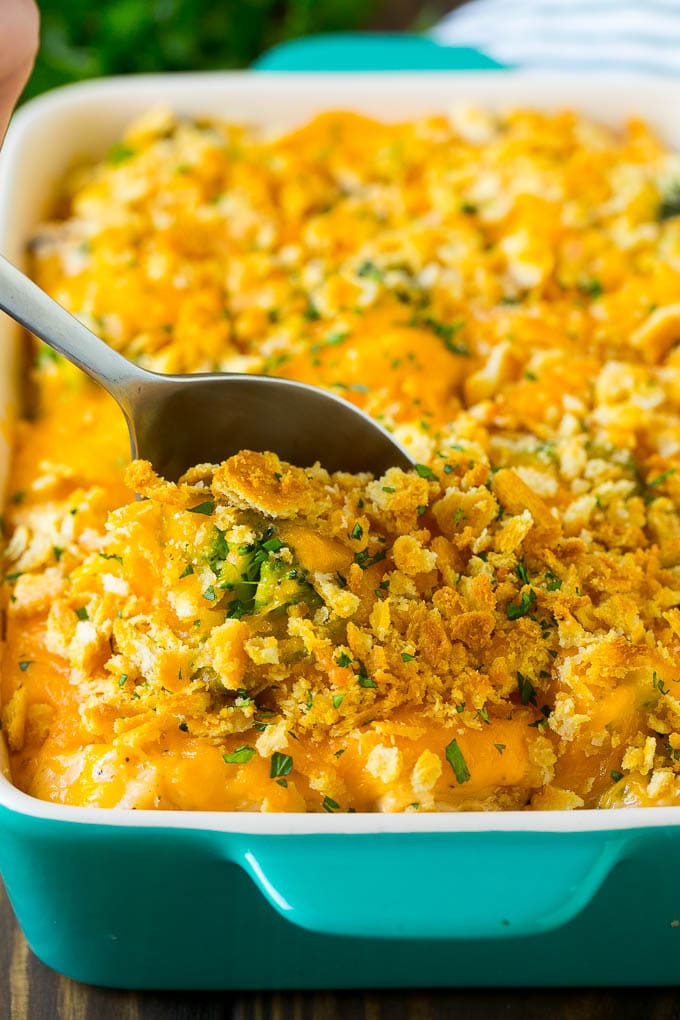 Chicken Casserole Recipe | Chicken and Rice Casserole | Chicken and Broccoli Casserole #casserole #chicken #rice #broccoli #cheese #dinner #ezlod A spoon in a dish of chicken and rice casserole.