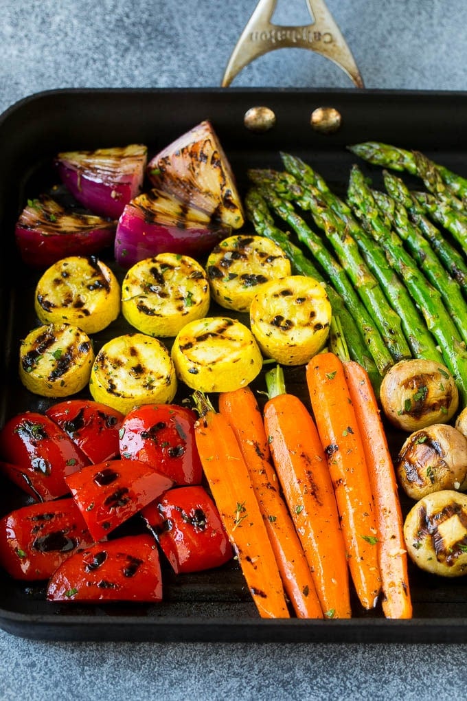 Grilled Vegetables Recipe | Marinated Vegetables | Grilled Veggies #vegetables #veggies #grilling #glutenfree #lowcarb #keto #dinner #ezlod #cleaneating #healthy A grill pan with an assortment of vegetables cooking on it.