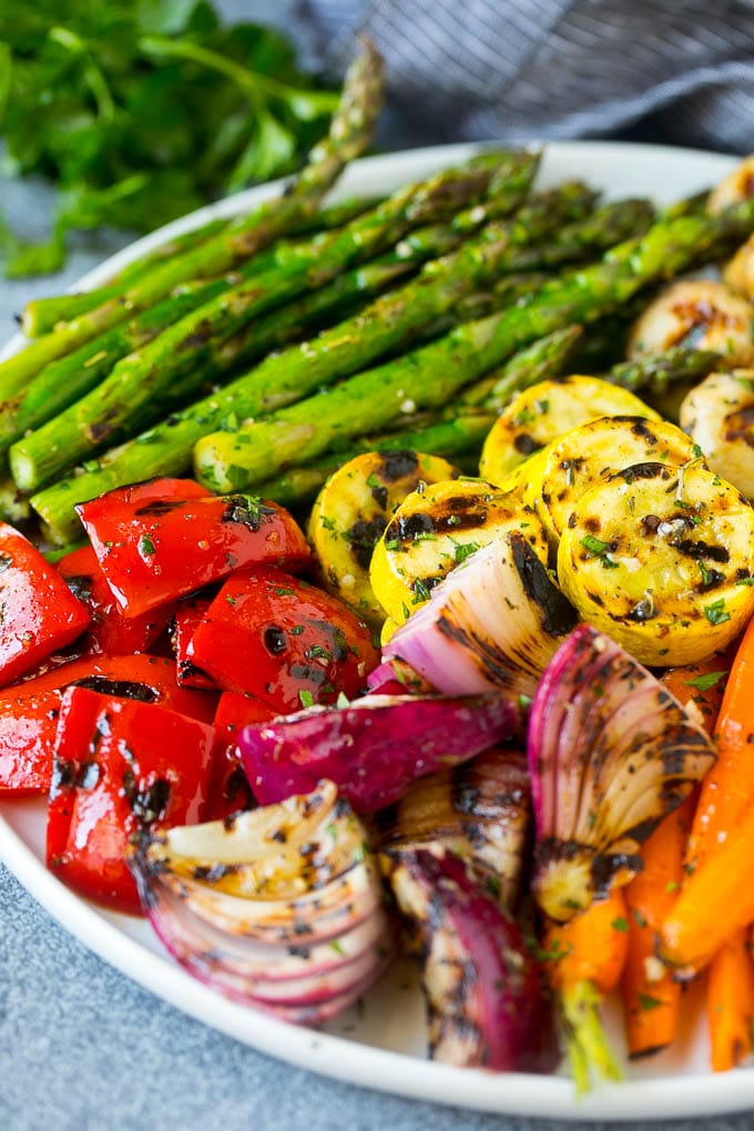 Grilled Vegetables Recipe | Marinated Vegetables | Grilled Veggies #vegetables #veggies #grilling #glutenfree #lowcarb #keto #dinner #ezlod #cleaneating #healthy A platter of grilled veggies including peppers, onions and carrots.