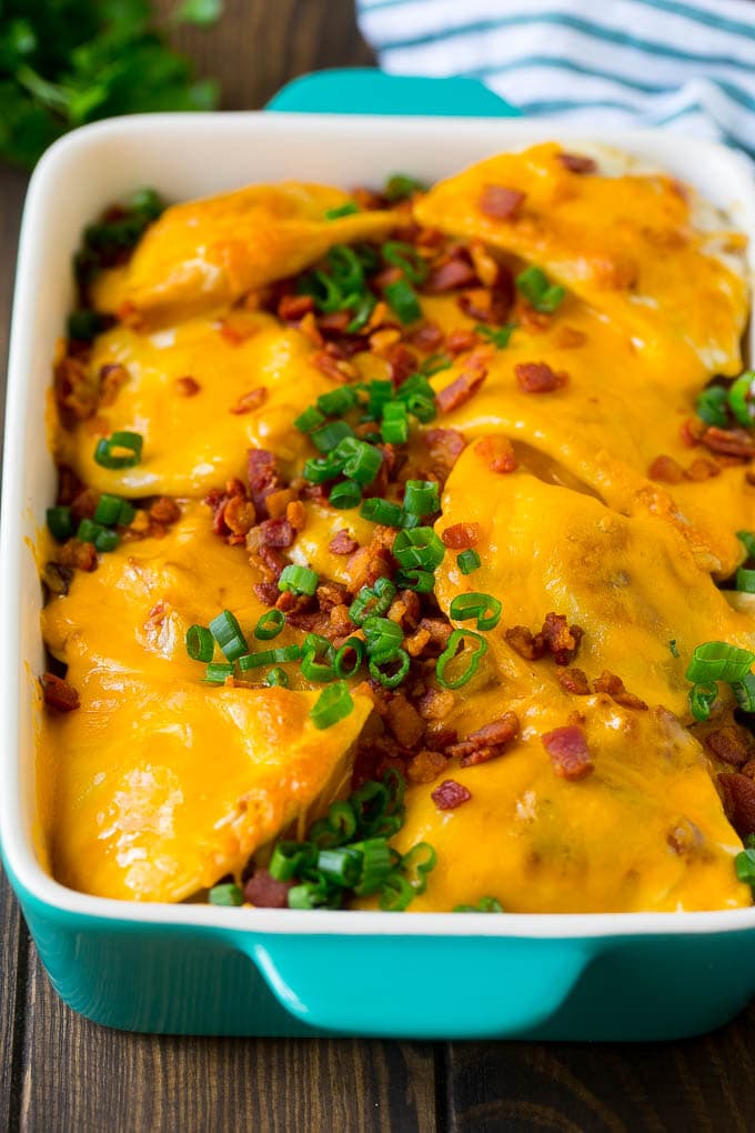 Pierogi Casserole Recipe | Potato Casserole #pierogis #casserole #bacon #cheddar #dinner #ezlod A baked pierogi casserole topped with melted cheese, bacon and green onions.