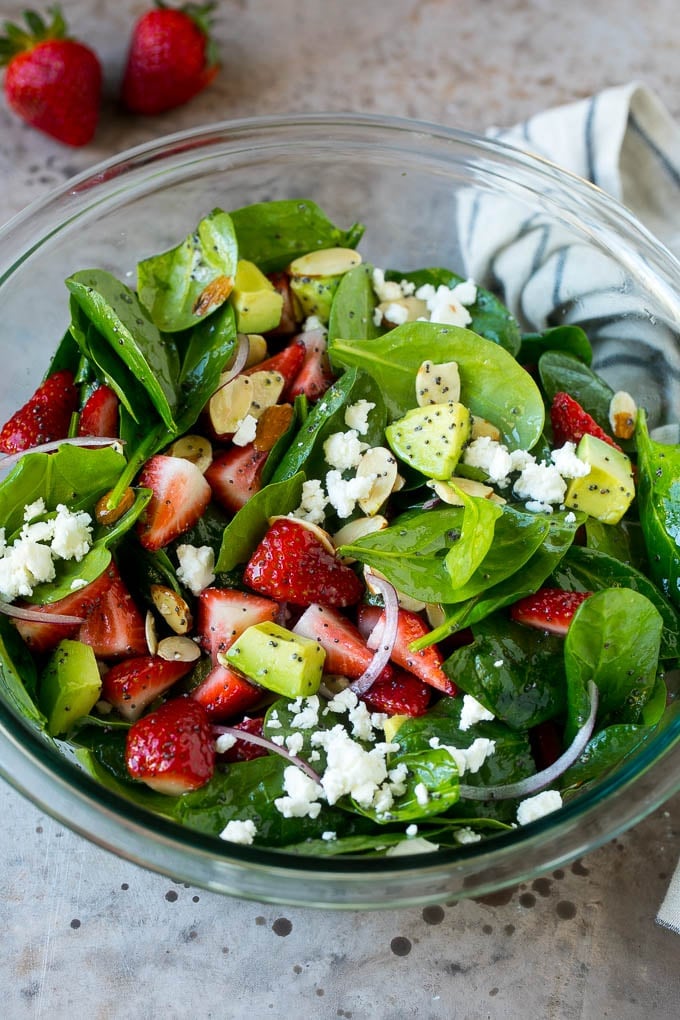 Strawberry Spinach Salad Recipe | Strawberry Salad | Spinach Salad #spinach #salad #strawberries #avocado #ezlod A bowl of strawberry spinach salad with feta cheese, almonds and avocado.