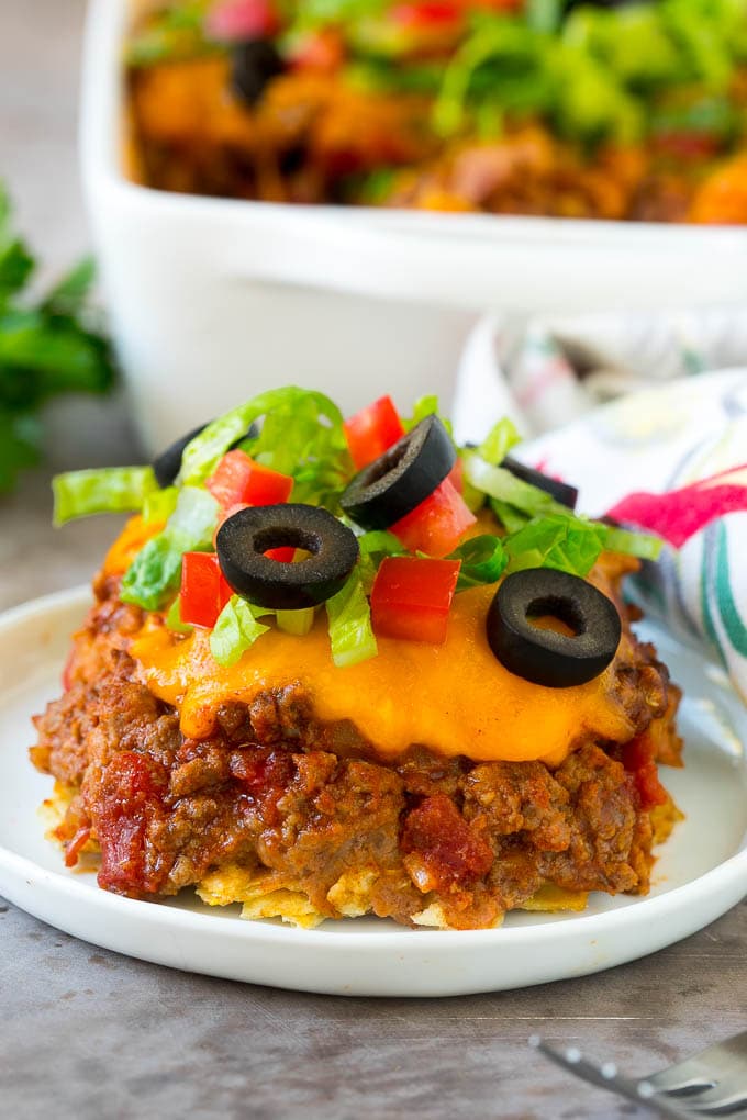 Taco Casserole Recipe | Mexican Casserole | Beef Casserole #casserole #tacos #beef #dinner #cheese #ezlod A serving of taco casserole topped with melted cheese.