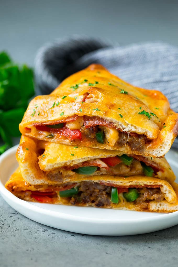 Calzone Recipe | Pizza Pockets #pizza #calzone #pepperoni #sausage #peppers #dinner #ezlod #cheese Calzone halves stuffed with sausage, peppers, cheese and pepperoni.