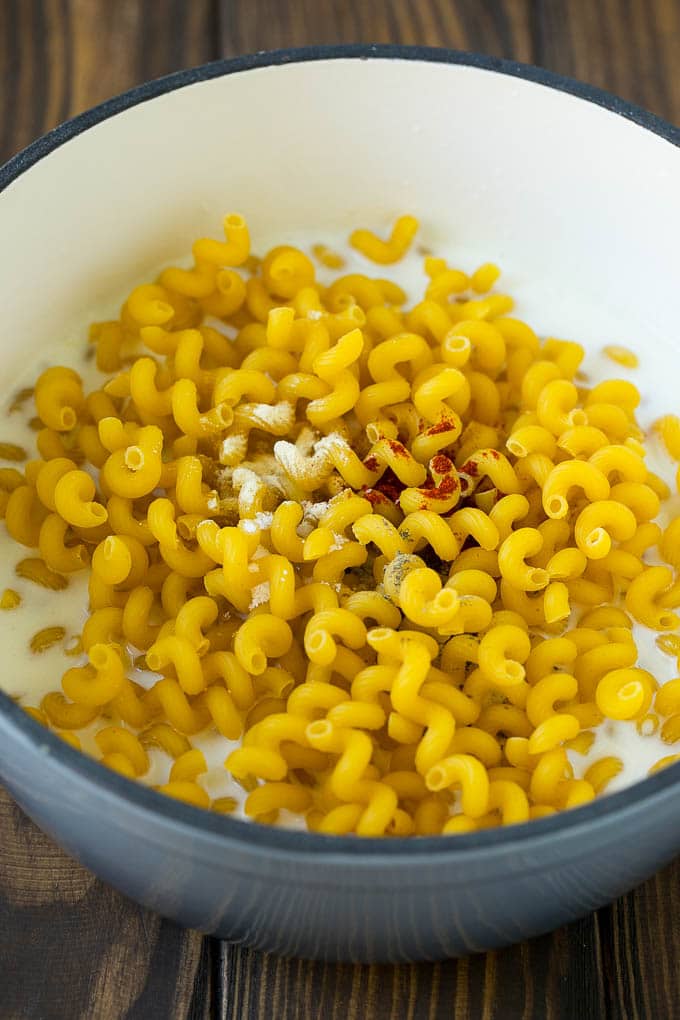 Lobster Mac and Cheese Recipe | Lobster Macaroni and Cheese | Baked Mac and Cheese #pasta #macandcheese #macaroni #lobster #cheese #dinner #ezlod Pasta with milk and spices in a pot.