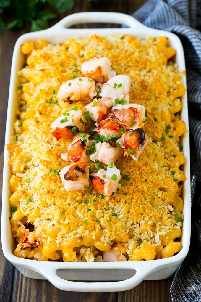 Lobster Mac and Cheese Recipe | Lobster Macaroni and Cheese | Baked Mac and Cheese #pasta #macandcheese #macaroni #lobster #cheese #dinner #ezlod A baking dish of lobster macaroni and cheese, garnished with chopped lobster meat.
