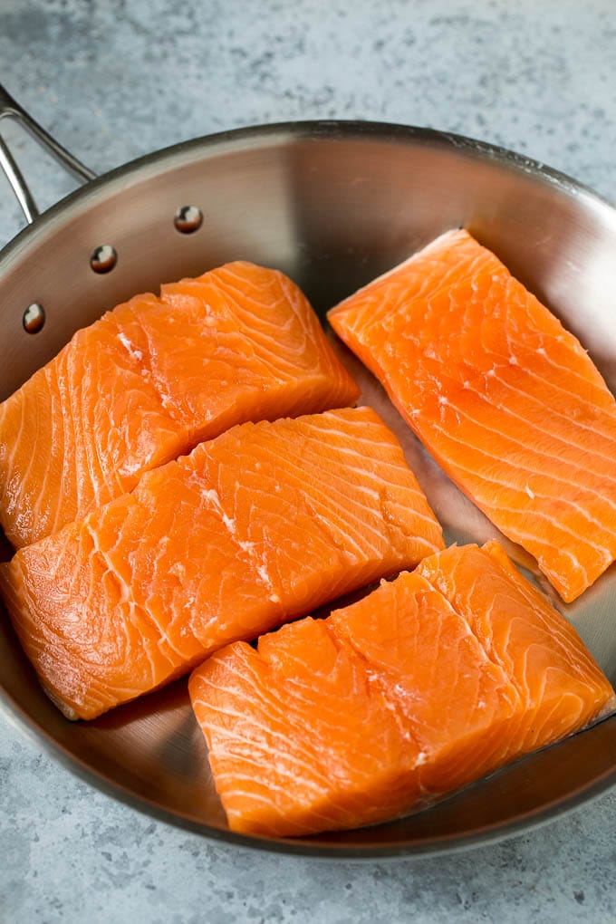 Pan Seared Salmon Recipe | Garlic Butter Salmon | Seared Salmon #salmon #garlic #butter #keto #lowcarb #dinner #ezlod Raw salmon fillets in a pan.