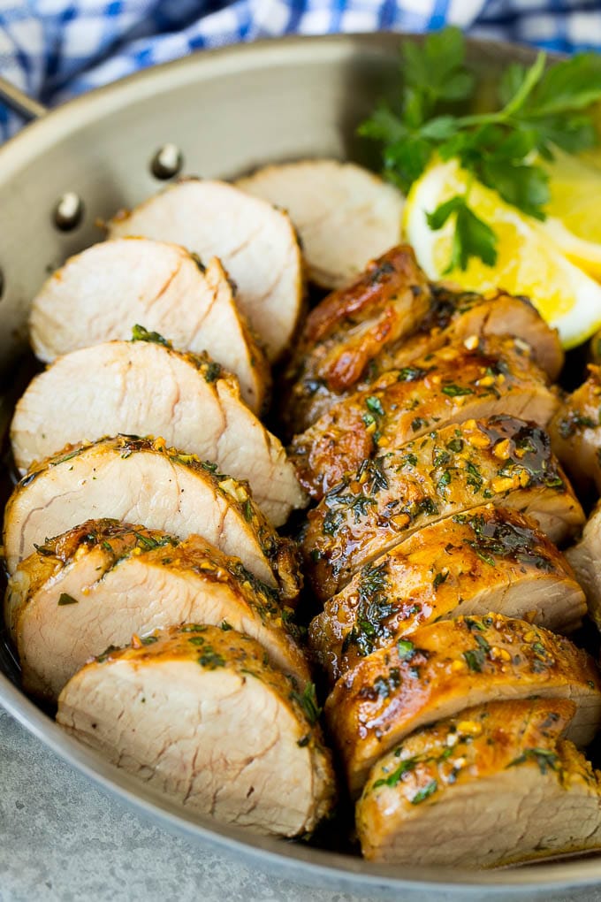Marinated Pork Tenderloin Recipe | Pork Tenderloin Marinade | Pork Marinade #pork #porktenderloin #marinade #dinner #grilling #ezlod Pork tenderloin marinade with sliced cooked pork in a skillet.