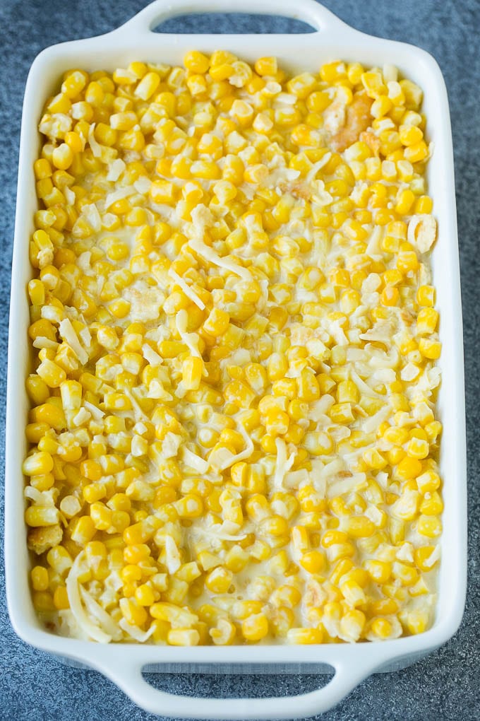 Scalloped Corn | Corn Casserole #corn #casserole #cheese #sidedish #dinner #ezlod A baking pan of corn in a creamy custard mixture.