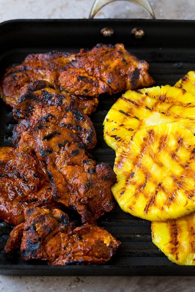 Tacos al Pastor Recipe | Pork Tacos | Mexican Tacos #tacos #pork #pineapple #grilling #tacotuesday #dinner #ezlod Grilled pork and pineapple on a pan.