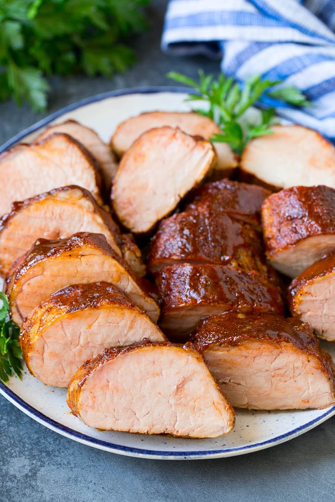 Smoked Pork Tenderloin Recipe | Smoked Pork Loin | BBQ Pork #pork #tenderloin #smoker #dinner #ezlod Smoked pork tenderloin sliced on a serving plate.