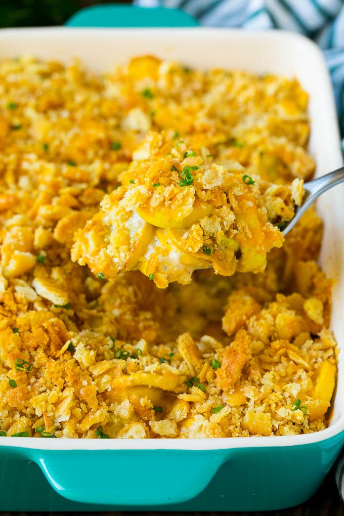 Squash Casserole Recipe | Vegetable Casserole | Zucchini Casserole #casserole #squash #zucchini #cheese #sidedish #ezlod A spoon serving up a portion of cheesy squash casserole.