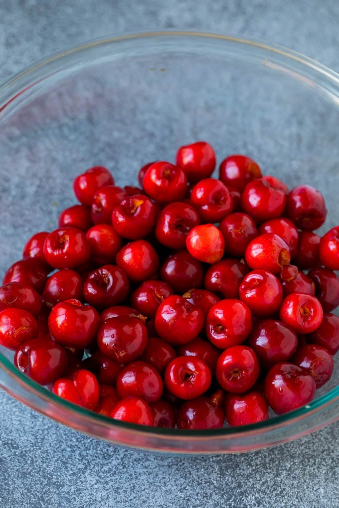Cherry Pie Filling Recipe #pie #cherries #dessert #sweets #ezlod #summer A bowl of pitted cherries.