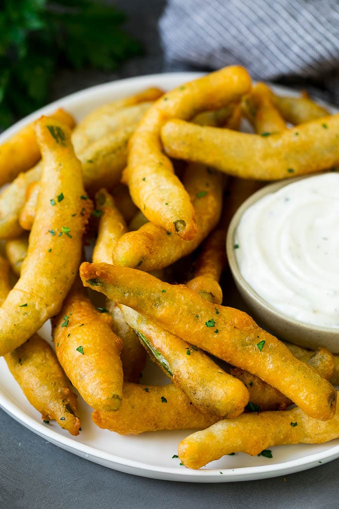 Fried Green Beans Recipe | Green Beans #greenbeans #appetizer #snack #ezlod A plate of fried green beans served with ranch dip.
