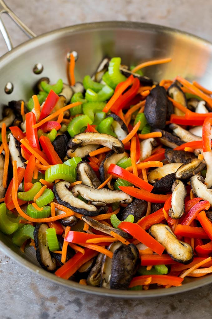Stir Fry Noodles Recipe | Noodle Stir Fry #chicken #noodles #stirfry #mushrooms #dinner #ezlod Mushrooms, bell pepper, celery and carrot in a pan.