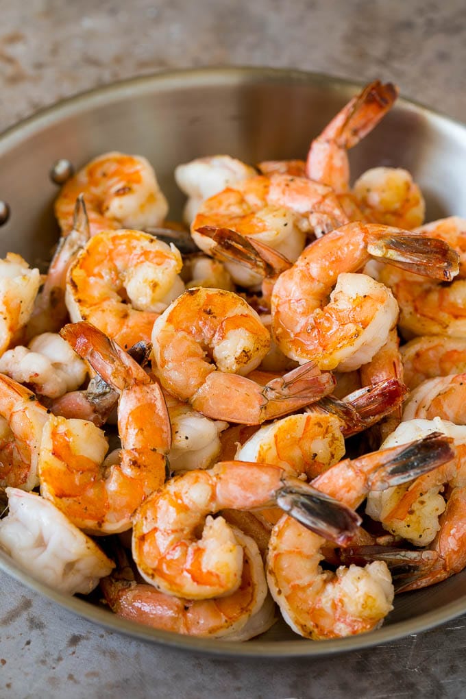 Surf and Turf Recipe | Seared Steak #steak #shrimp #keto #lowcarb #dinner #ezlod Sauteed jumbo shrimp in a skillet.