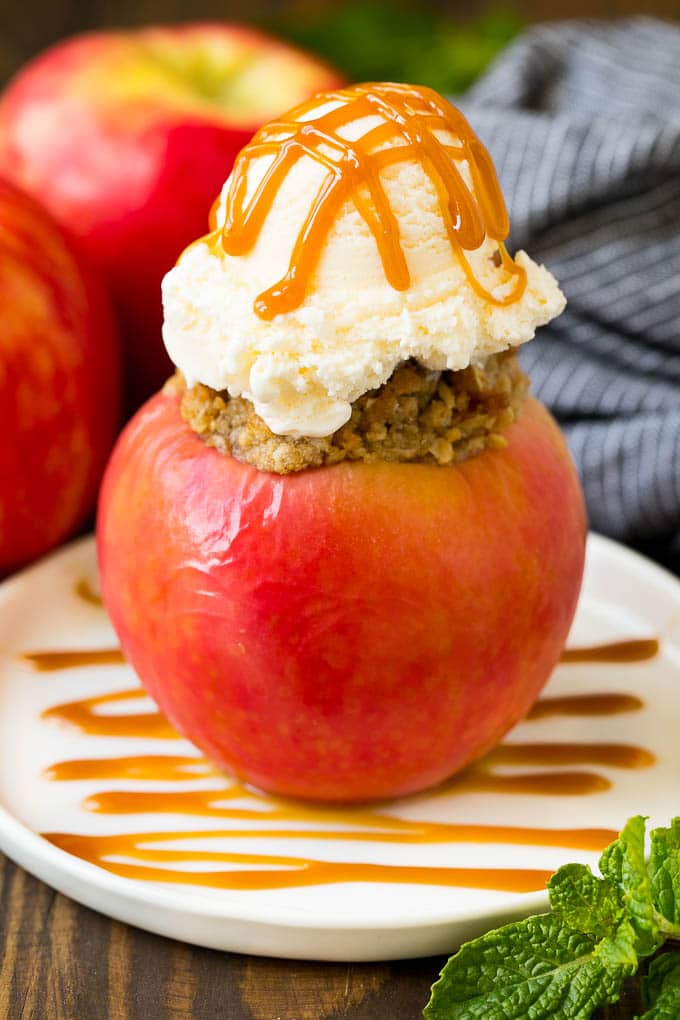 Baked Apples | Stuffed Apples #apples #fall #dessert #sweettooth #ezlod A baked apple topped with vanilla ice cream and caramel sauce.