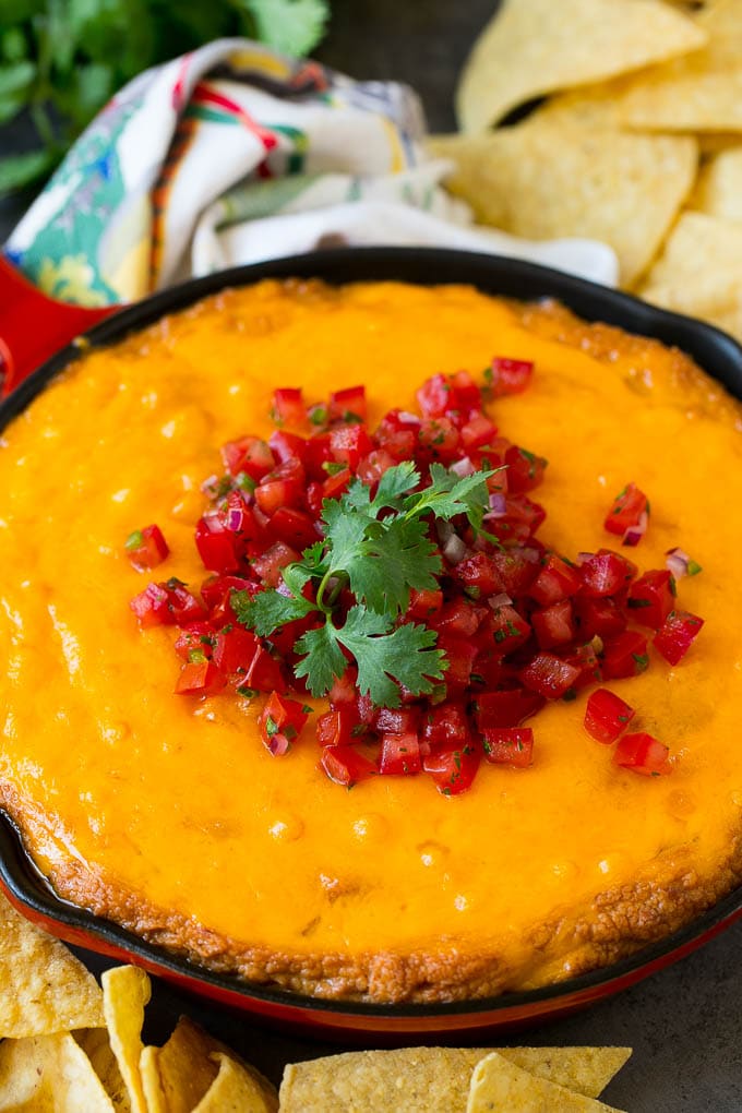 Bean Dip Recipe | Mexican Dip #dip #appetizer #mexicanfood #beans #cheese #ezlod Cheesy Mexican bean dip topped with melted cheese and pico de gallo.