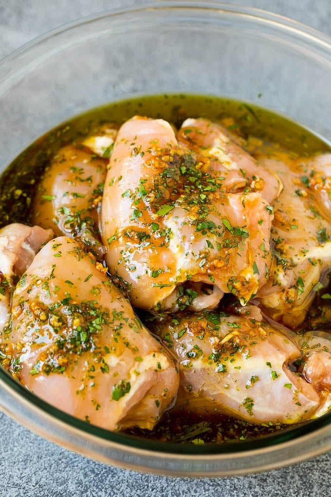 Grilled Chicken Thighs Recipe | Marinated Chicken Thighs #chicken #grilling #marinade #dinner #cilantro #lime #ezlod Poultry in a bowl of marinade.