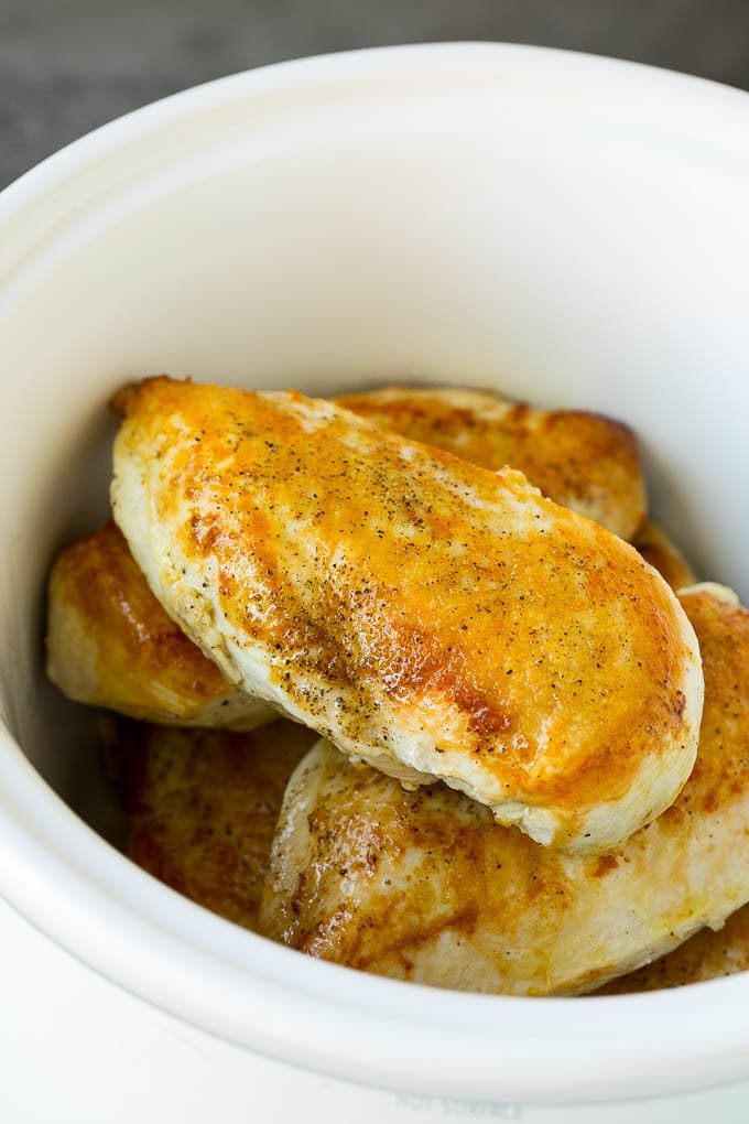 Slow Cooker Chicken Breast Recipe | Crock Pot Chicken Breast | Chicken and Gravy #chicken #slowcooker #crockpot #gravy #dinner #ezlod Seared chicken breasts in a crock pot.