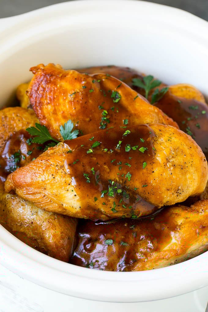 Slow Cooker Chicken Breast Recipe | Crock Pot Chicken Breast | Chicken and Gravy #chicken #slowcooker #crockpot #gravy #dinner #ezlod Slow cooker chicken breast topped with gravy and parsley.