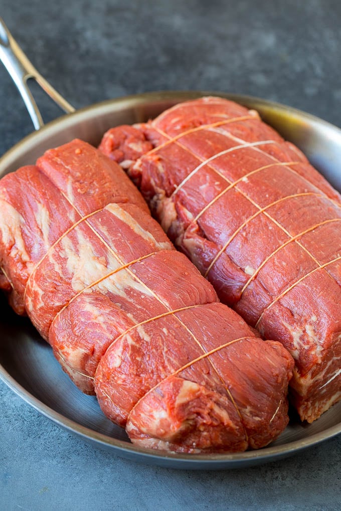 Beef Tenderloin with Garlic Butter #beef #steak #dinner #ezlod Beef tenderloin roasts tied with twine.