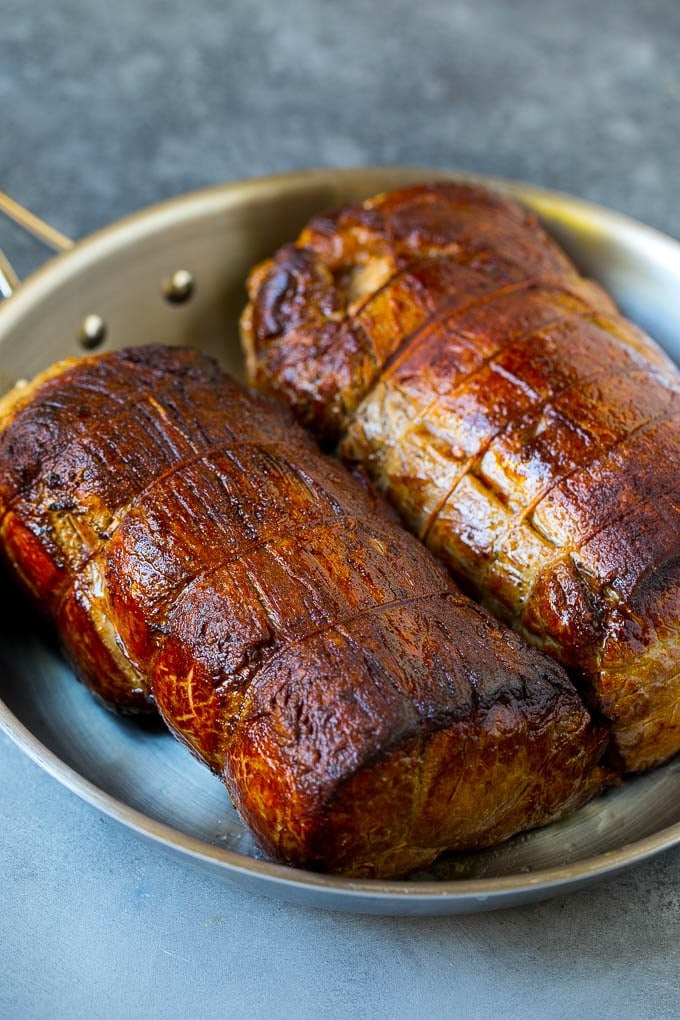 Beef Tenderloin with Garlic Butter #beef #steak #dinner #ezlod Seared tenderloin roasts in a pan.