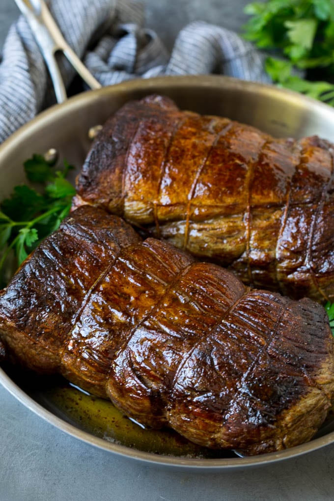 Beef Tenderloin with Garlic Butter #beef #steak #dinner #ezlod Roasted garlic butter beef tenderloin in a pan.