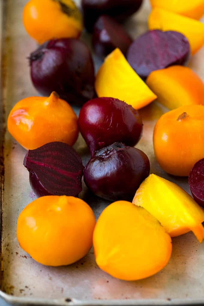 Beet Salad Recipe #beets #avocado #feta #salad #dinner #ezlod Roasted red and yellow beets on a sheet pan.