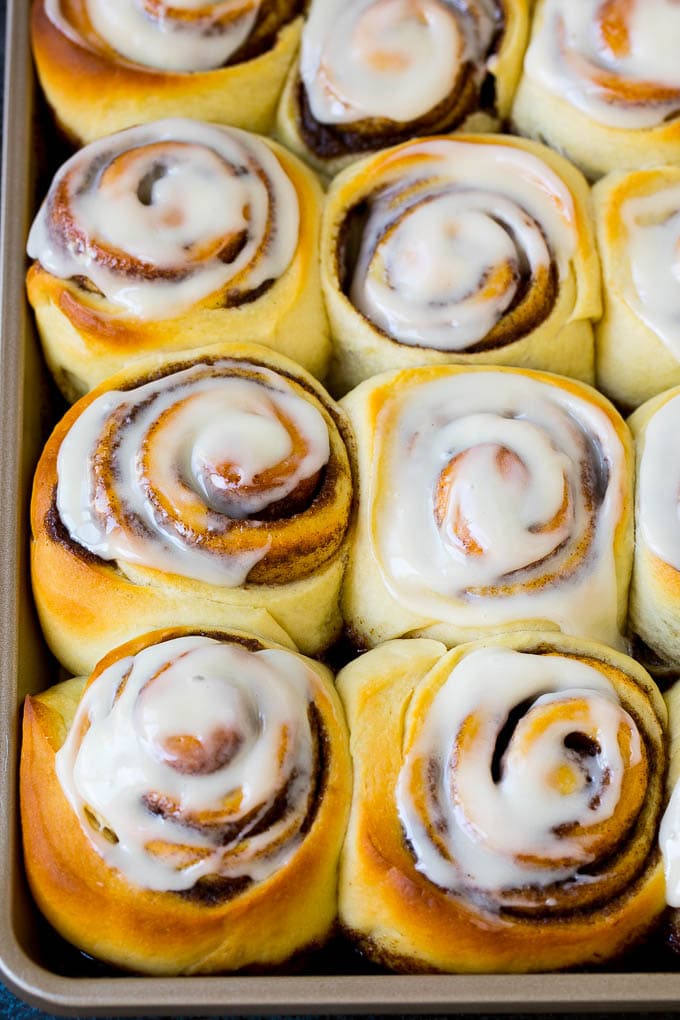 Cinnamon Rolls Recipe | Cinnamon Buns #cinnamon #rolls #pastry #breakfast #brunch #sweets #ezlod #baking #bread A tray of frosted cinnamon rolls.
