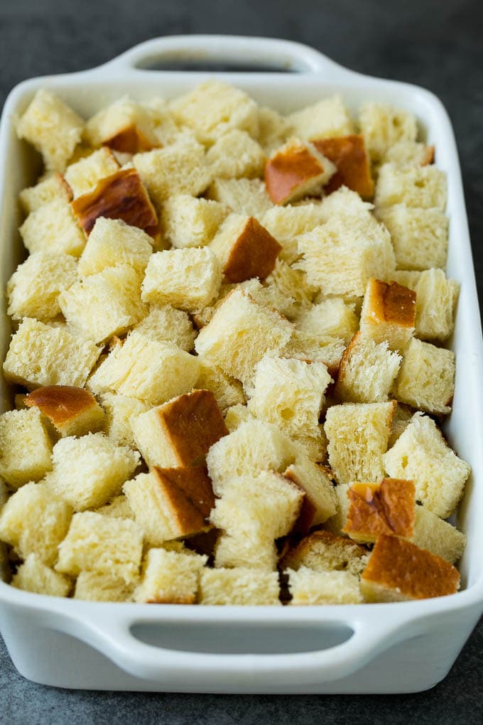 French Toast Casserole Recipe | French Toast Bake #frenchtoast #casserole #breakfast #brunch #ezlod #bread Cubes of bread in a baking dish.
