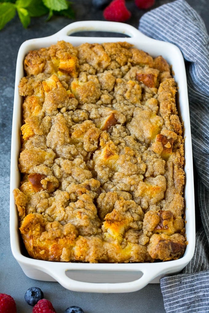 French Toast Casserole Recipe | French Toast Bake #frenchtoast #casserole #breakfast #brunch #ezlod #bread A dish of french toast casserole topped with brown sugar streusel.