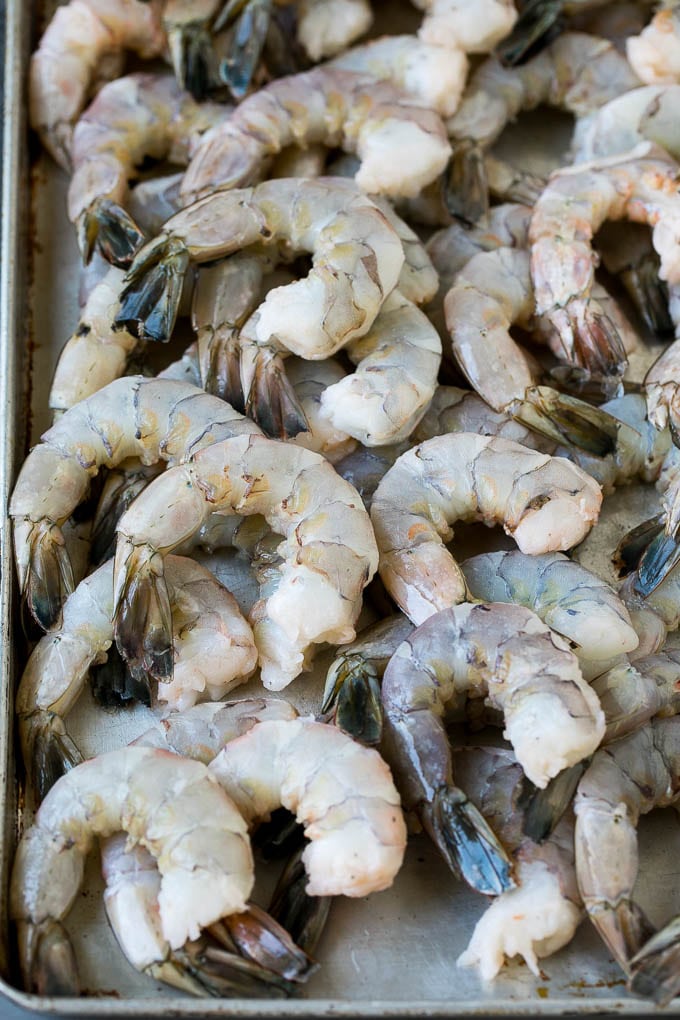 Fried Shrimp Recipe #shrimp #seafood #dinner #appetizer #ezlod Raw shrimp on a sheet pan.