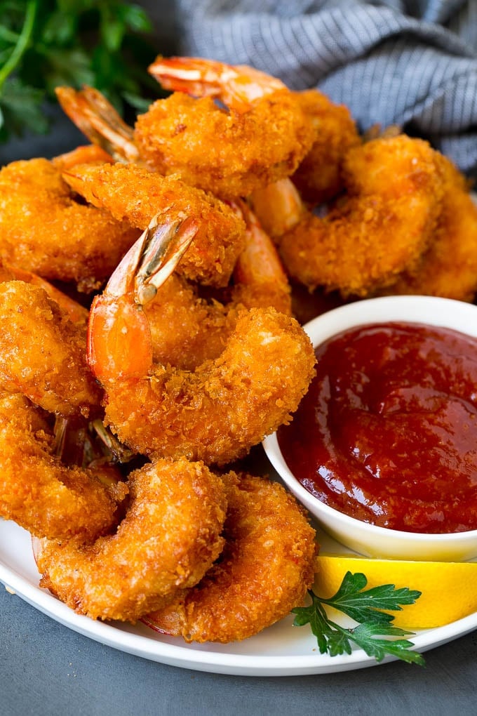 Fried Shrimp Recipe #shrimp #seafood #dinner #appetizer #ezlod A plate of fried shrimp served with cocktail sauce.